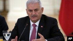 Turkish Prime Minister Binali Yildirim speaks during a meeting with representatives of German companies, in Ankara, Turkey, July 27, 2017.