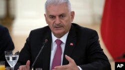 Turkish Prime Minister Binali Yildirim speaks during a meeting with representatives of German companies, in Ankara, Turkey, July 27, 2017.