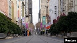 FILE - Bourke Street mall, a normally busy shopping hub in Melbourne, is seen devoid of people after the city reimposed restrictions as part of efforts to curb a resurgence of the coronavirus disease (COVID-19), July 23, 2020. 