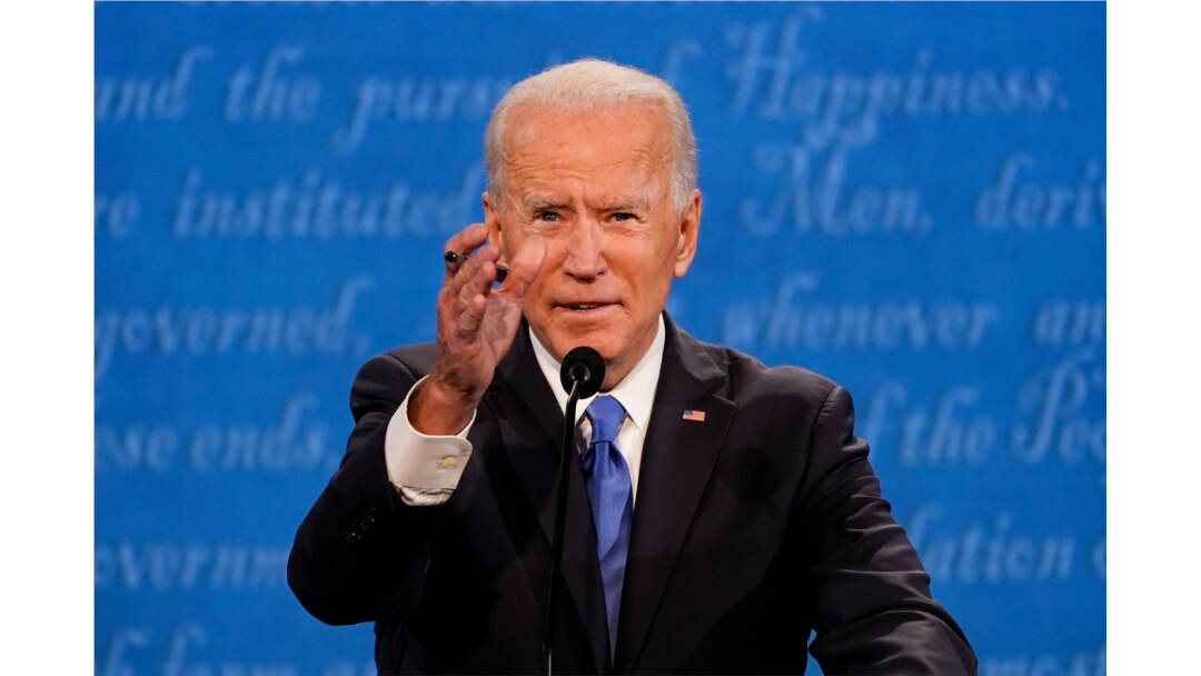 Democratic presidential candidate former Vice President Joe Biden gestures while speaking during the second and final presidential debate Thursday, Oct. 22, 2020, at Belmont University in Nashville, Tenn. (AP Photo/Julio Cortez)