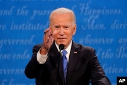 Democratic presidential candidate former Vice President Joe Biden gestures while speaking during the second and final presidential debate Thursday, Oct. 22, 2020, at Belmont University in Nashville, Tenn. (AP Photo/Julio Cortez)