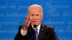 Democratic presidential candidate former Vice President Joe Biden gestures while speaking during the second and final presidential debate Thursday, Oct. 22, 2020, at Belmont University in Nashville, Tenn. (AP Photo/Julio Cortez)