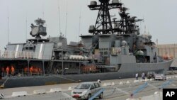 FILE - Russian sailors are seen aboard the Admiral Panteleyev Russian warship moored at the Mediterranean port of Limassol, Cyprus, May 17, 2013.