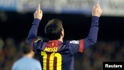 Lionel Messi na FC Barcelona, wanda ya jefa kwallaye 3 a ragar Real Madrid, lahadi 23 Maris 2014