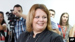 FILE - Public prosecutor Katica Janeva takes an oath as a special prosecutor to investigate claims that the conservative government ordered a massive wiretapping operation, Skopje, Macedonia, Sept. 16, 2015. Janeva unexpectedly resigned in July.
