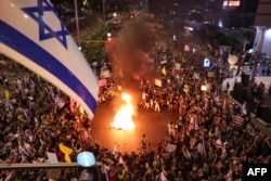 Demonstrators protest in front of the Israeli Defense Ministry in Tel Aviv, Israel, Sept. 7, 2024. Protesters demanded action to secure the release of Israeli hostages held captive since Oct. 7, 2023.