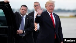 U.S. President Donald Trump arrives to board Air Force One to return to Washington at the conclusion on their holiday vacation, from Palm Beach International Airport in West Palm Beach, Florida, Jan. 1, 2018.