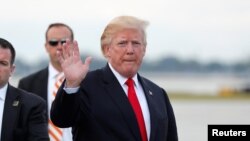 U.S. President Donald Trump arrives to board Air Force One to return to Washington at the conclusion on their holiday vacation, from Palm Beach International Airport in West Palm Beach, Florida, Jan. 1, 2018.