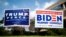 Letreros de jardín que apoyan al presidente de EE.UU., Donald Trump, y al candidato presidencial demócrata Joe Biden, se ven afuera de un sitio de votación anticipada en Fairfax, Virginia, el 18 de septiembre de 2020.