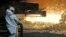 FILE - In this April 27, 2018 photo a steel worker watches the hot metal at the Thyssenkrupp steel factory in Duisburg, Germany. 