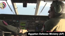 An Egyptian plane searches in the Mediterranean Sea for the missing EgyptAir flight 804 plane, which crashed after disappearing from the radar early Thursday while carrying 66 passengers and crew from Paris to Cairo, in video image released May 19, 2016. 