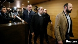 Cardinal Philippe Barbarin, Archbishop of Lyon, walks inside the courthouse during a break in his trial, charged with failing to act on historical allegations of sexual abuse of boy scouts by a priest in his diocese, Lyon, France, Jan. 7, 2019.