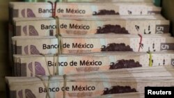 Bundles of Mexican peso banknotes are pictured at a currency exchange shop in Ciudad Juarez, Mexico, Jan. 15, 2018.