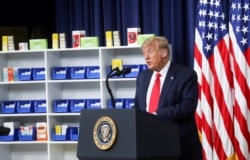 FILE - U.S. President Donald Trump speaks prior to signing executive orders on lowering drug prices in the Eisenhower Executive Office Building at the White House in Washington, July 24, 2020.