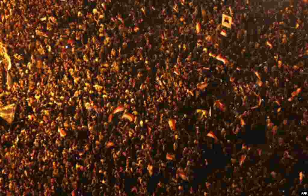 Egyptians celebrate after President Hosni Mubarak resigned and handed power to the military at Tahrir Square, in Cairo, Egypt, Friday, Feb. 11, 2011. Egypt exploded with joy, tears, and relief after pro-democracy protesters brought down President Hosni Mu