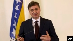 FILE - Bosnian Prime Minister Denis Zvizdic addresses the media during a news conference in Vienna, Austria, March 20, 2017.