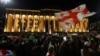 FILE - Demonstrators protest a bill on "foreign agents," near Georgian Parliament building, in Tbilisi, Georgia, May 13, 2024. 