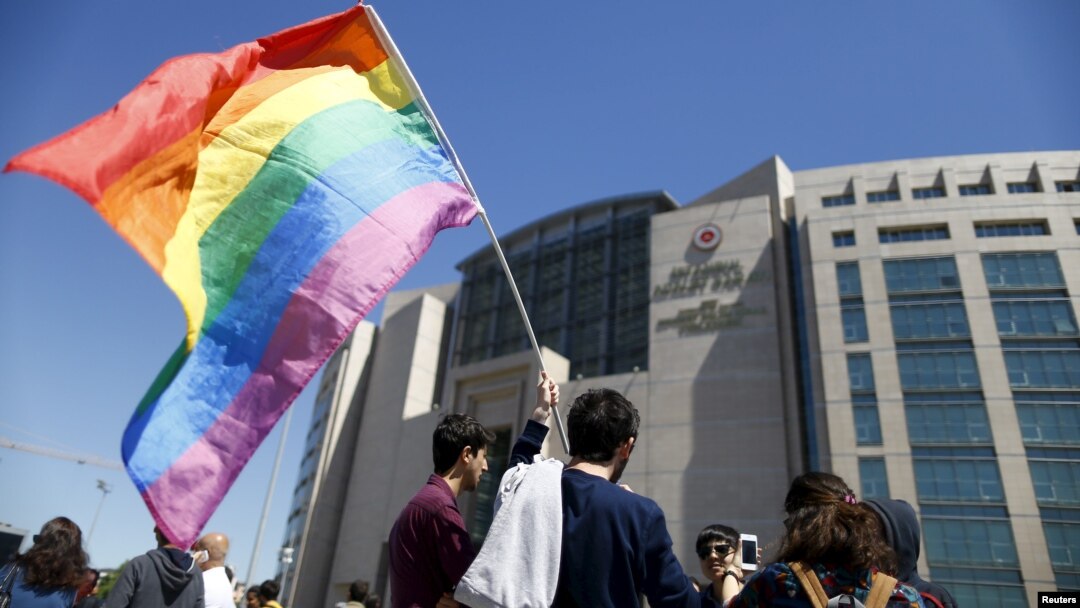 Demonstrators wait in front of the Justice Palace during a hearing against opposition academics, in Istanbul, Turkey, April 22, 2016. 
