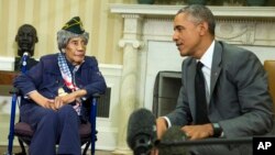 President Barack Obama meets with Emma Didlake, 110, of Detroit, the oldest known World War II veteran, July 17, 2015, in the Oval Office of the White House in Washington.