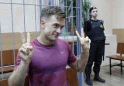 FILE - Pyotr Verzilov gestures during a court hearing in Moscow, July 16, 2018.