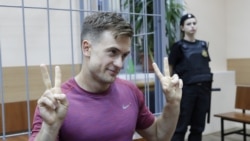 FILE - Pyotr Verzilov gestures during a court hearing in Moscow, July 16, 2018.