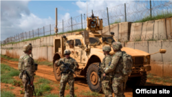 FILE - U.S. Army soldiers discuss security operations during a patrol in Somalia in December 2019. (Nick Kibbey/U.S. Air Force)