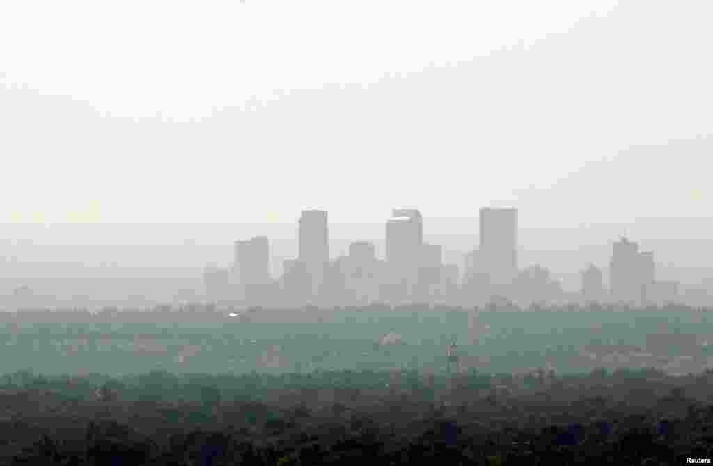 The downtown skyline of Denver, Colorado is obscured by smoke from the many wildfires burning in the state.