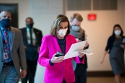 FILE - Speaker of the House Nancy Pelosi, D-Calif., walks to a news conference at the Capitol, Feb. 25, 2021.