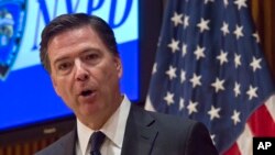 Direktur FBI, James Comey memberikan keterangan pers di New York, Rabu (16/12).