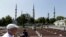 FILE - Tourists visit the Sultan Ahmed Mosque, also known as Blue Mosque, in Istanbul, Aug. 11, 2016. Tourism is a key sector and foreign-currency earner for Turkey, but numbers have dropped sharply as a result of a series of attacks in the country and an attempted coup in July.