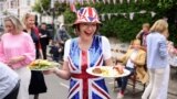 People take part in a Big Lunch event in Fulham