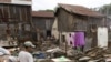 A man walks among the rubble of houses almost removed on the edge of Boeung Kak, Phnom Penh's largest lake.