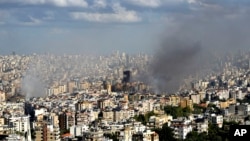 Asap mengepul dari kawasan yang terkena serangan udara Israel di Dahieh, Beirut, Lebanon, Rabu, 2 Oktober 2024. (Hussein Malla/AP)