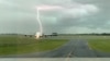 A lightning strikes near an Emirates A380 plane at Christchurch Airport, New Zealand November 20, 2019 in this still image obtained from a social media video. 