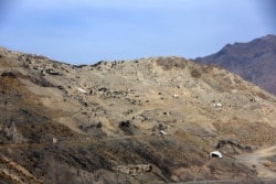 FILE - A general view of Mes Aynak valley, 40 kilometers southwest of Kabul, Afghanistan. The nation's massive, untouched wealth of minerals includes lithium, the silvery metal used in mobile phone and computer batteries.