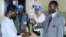 Man votes as UN observers look on in Bangui, Central African Republic