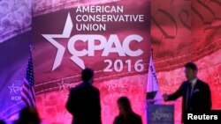 FILE - People walk on the stage on the final day of the 2016 Conservative Political Action Conference (CPAC) at National Harbor, Maryland, March 5, 2016. 