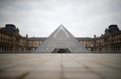 A view shows the deserted area in front of the glass Pyramid of the Louvre museum in Paris as a lockdown is imposed to slow the rate of the coronavirus disease (COVID-19) in France, March 18, 2020.