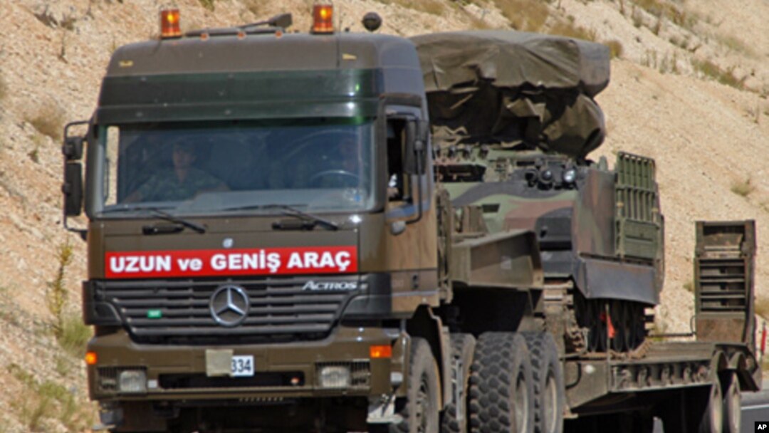 A Turkish military truck transports a mobile missile launcher to the Syrian border, near Kilis, Turkey, June 28, 2012. (AP).