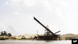 This Aug. 2, 2011 photo shows a sand depot just outside the provincial capital of Koh Kong in southwestern Cambodia. It is owned by Ly Yong Phat, one of the country's biggest tycoons who is being criticized for the environmental damage his sand mining ope