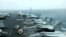 FILE - F/A-18F aircrafts are seen on the deck of USS Abraham Lincoln in the Gulf of Oman near the Strait of Hormuz, July 15, 2019. 