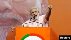 India's Prime Minister Narendra Modi addresses an election campaign rally ahead of the Karnataka state assembly elections in Bengaluru, India, May 8, 2018.