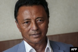 FILE —Former President of Madagascar and member of the collective of opposition candidates Marc Ravalomanana poses for a photograph during an interview in Antananarivo, on November 13, 2023.