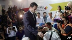 Henrique Capriles arrives for a press conference in Caracas, Venezuela, on March 10, 2013, to announce he will run in elections to replace late President Hugo Chavez.