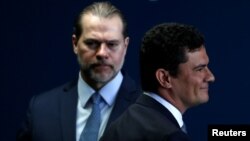 Brazil's new Justice Minister Sergio Moro attends his handover ceremony as the President of the Supreme Federal Court Dias Toffoli looks on, in Brasilia, Brazil, Jan. 2, 2018.