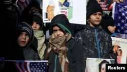 FILE - New York Yemeni Americans demonstrate in response to U.S. President Donald Trump's travel ban and recent denials of visa applications in Foley Square in lower Manhattan in New York City, Dec. 27, 2017.