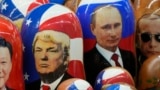 FILE - Traditional Russian wooden dolls depicting China's President Xi Jinping, U.S. President Donald Trump and Russian President Vladimir Putin are displayed for sale at a souvenir shop in St. Petersburg, Russia, on Nov. 21, 2024.