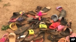 FILE - Flip flop sandals belonging to students of Bethel Baptist High School are seen following an attack by gunmen in Damishi Kaduna, Nigeria, July 6, 2021. 