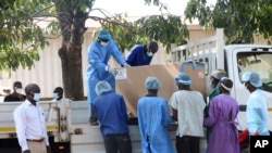 FILE - COVID-19 vaccines arrive to be destroyed, in Lilongwe, Malawi, May 19, 2021.