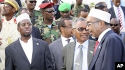 Somali President Sheik Sharif Sheik Ahmed, Puntland President, Abdurrahman Farole, middle, and Somalia Parliament Speaker, Sharif Hassan Sheik Adenduring , right, during the opening ceremony of the high level Consultative Meeting on Ending the Transition 